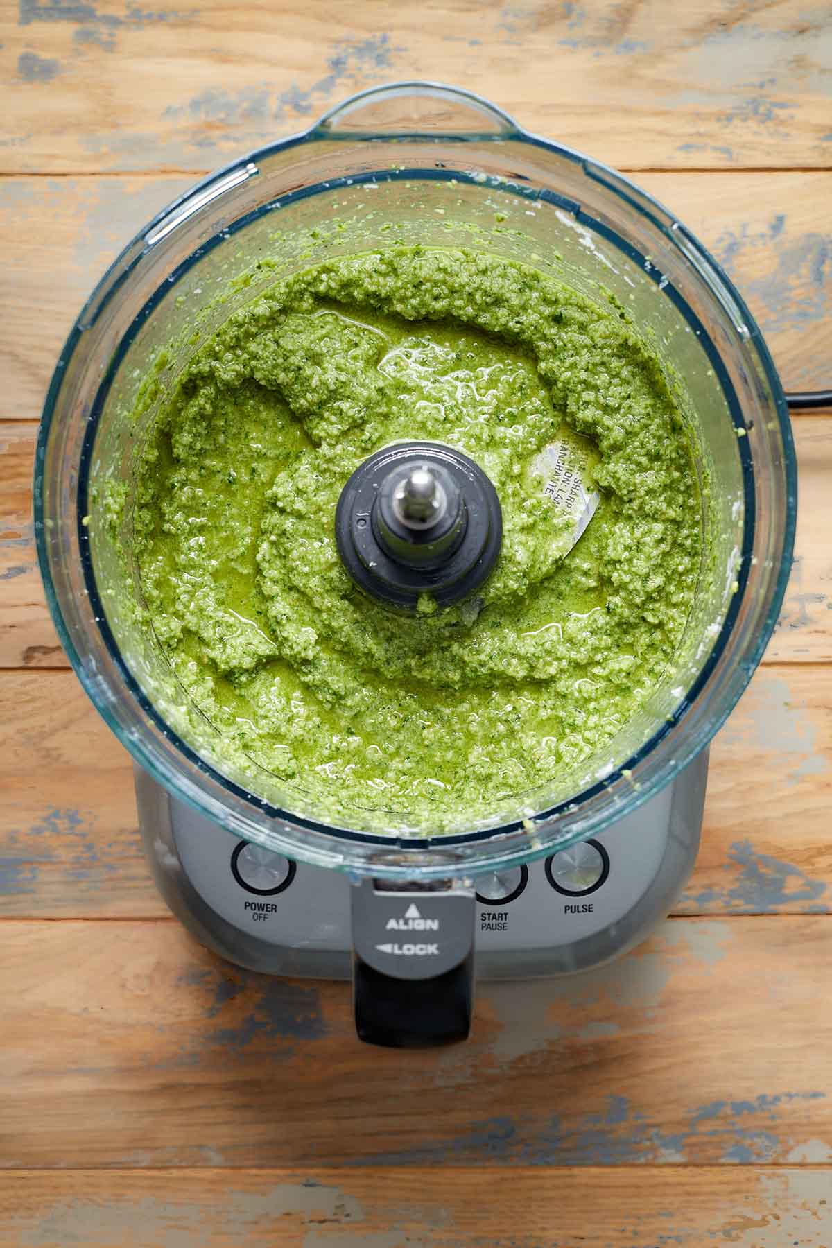 Blended pesto in a food processor.