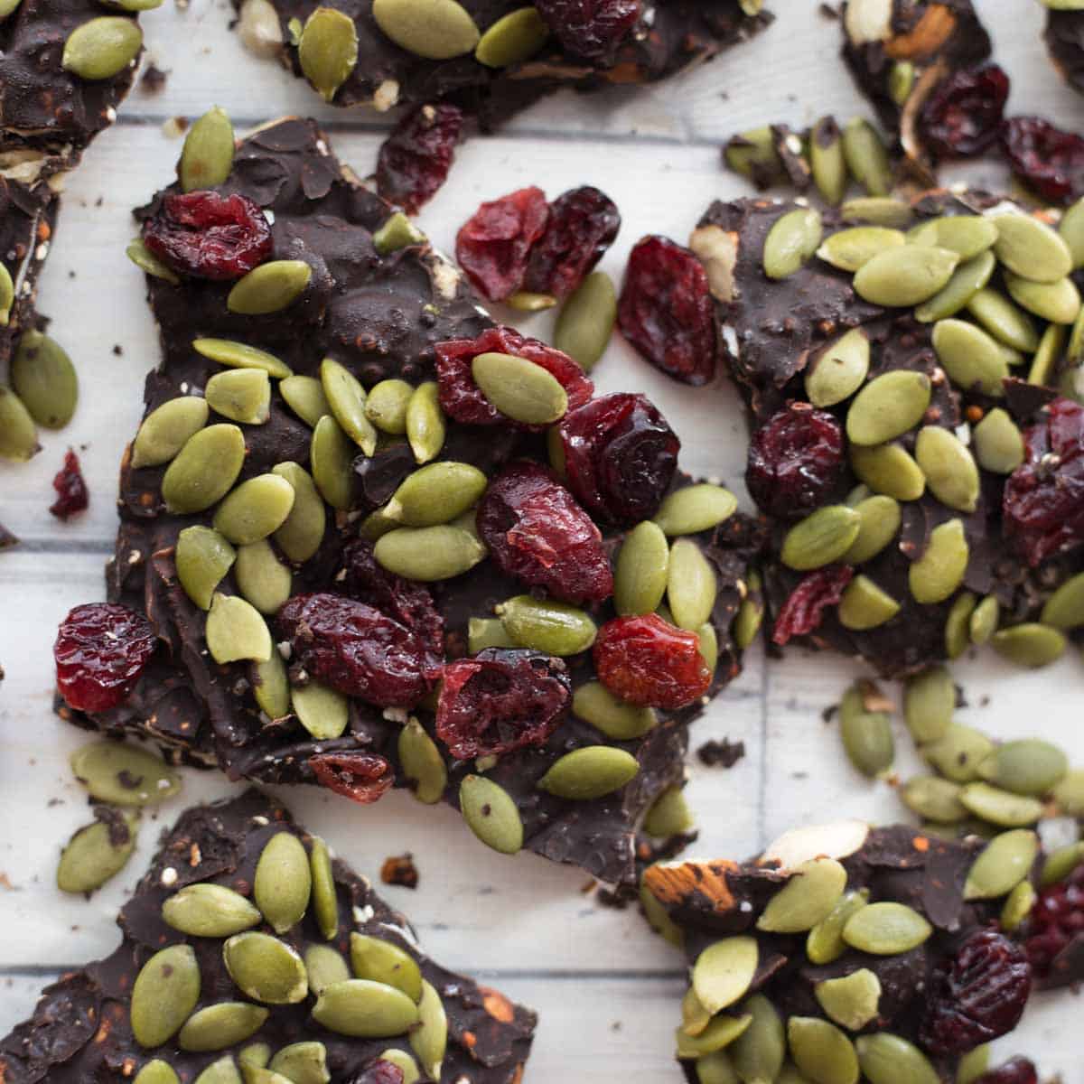Close up of cranberry pumpkin seed bark broken into pieces.