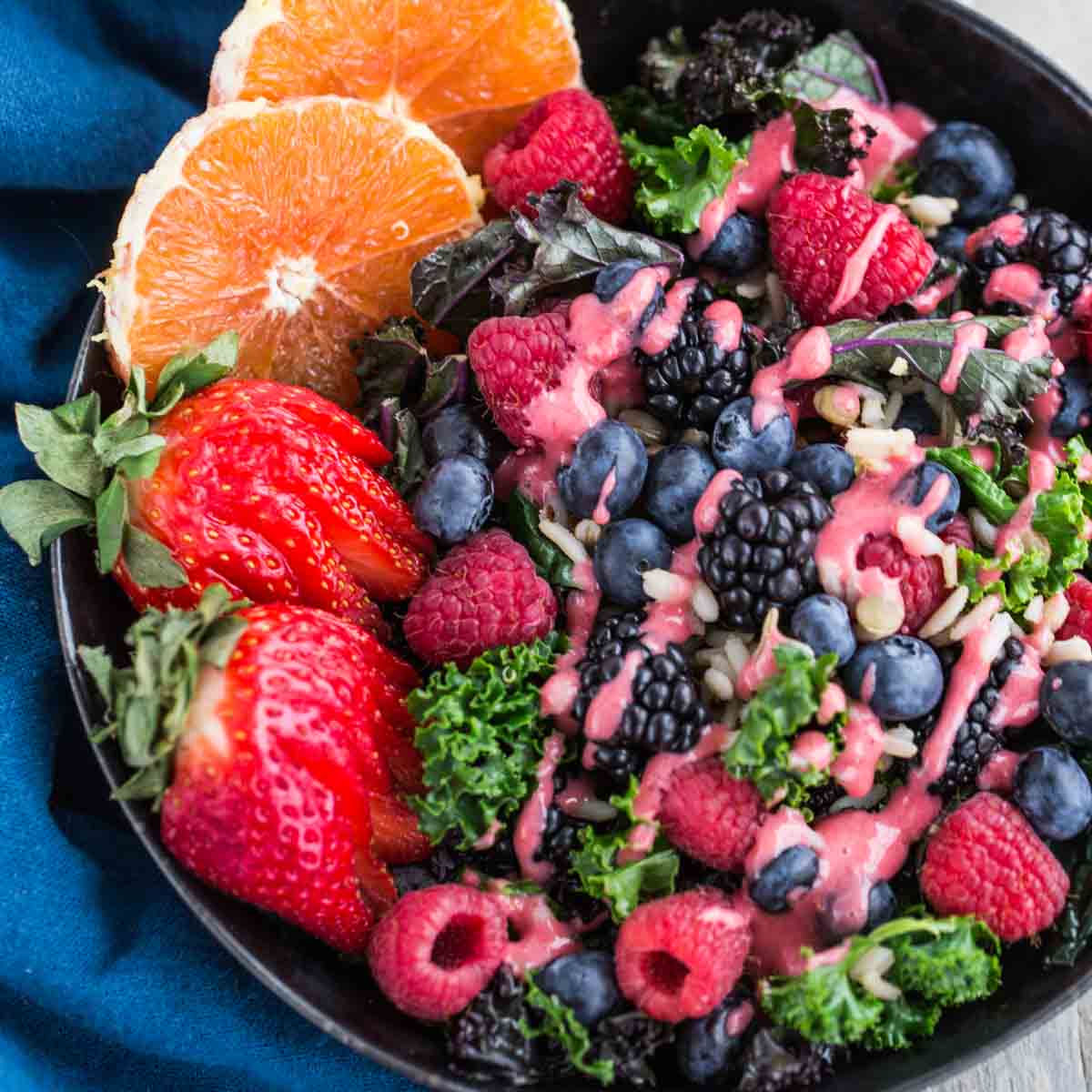 Close up of raspberry citrus salad in a bowl.