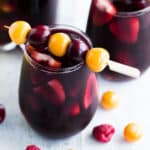 Berry kombucha sangria in stemless wine glasses.