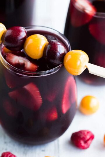 Berry kombucha sangria in stemless wine glasses.