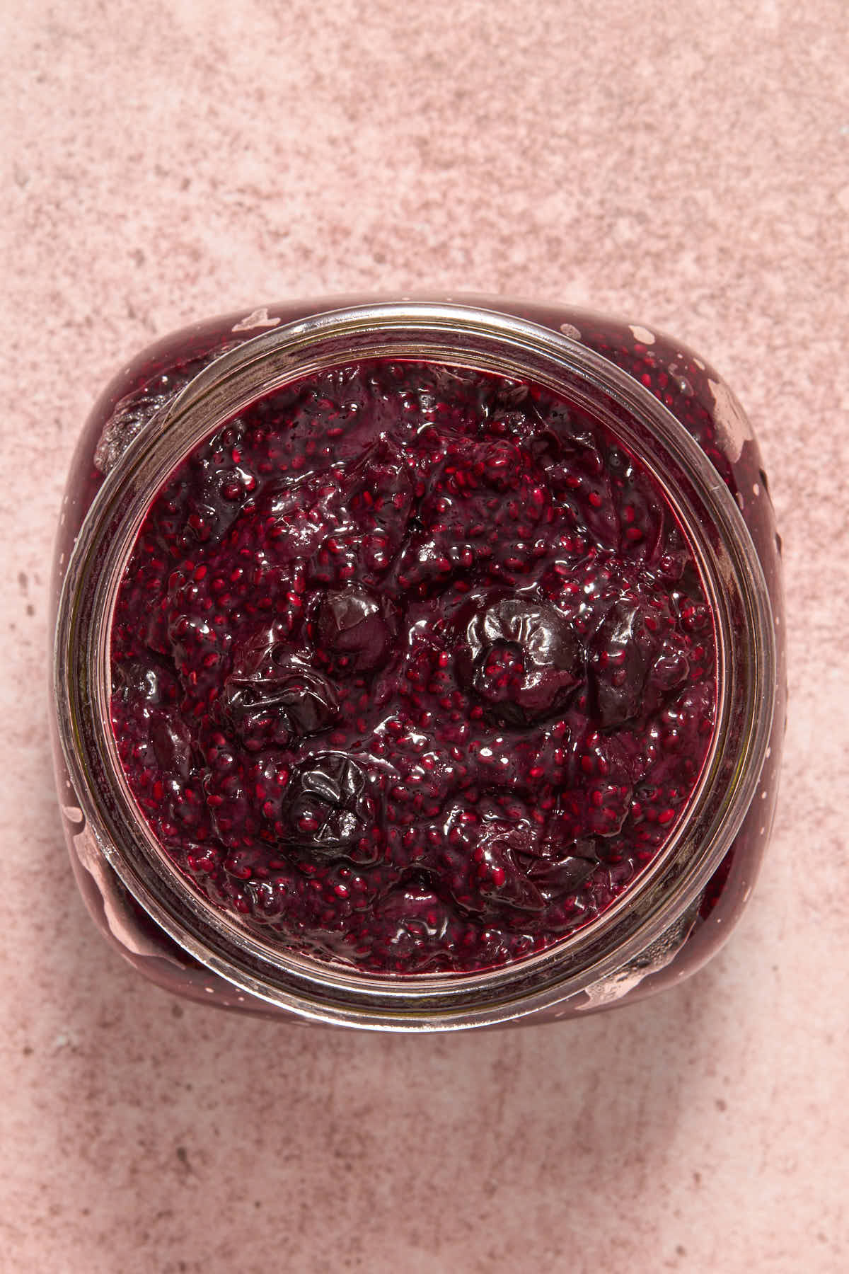 Jam in a wide mouth glass jar.