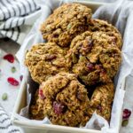 Pumpkin cranberry breakfast cookies piled in a container.
