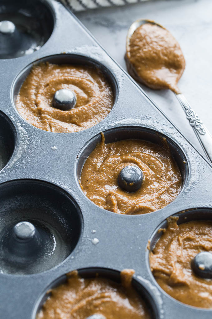 Close-up view of batter for Gingerbread Protein Donuts in a donut pan.