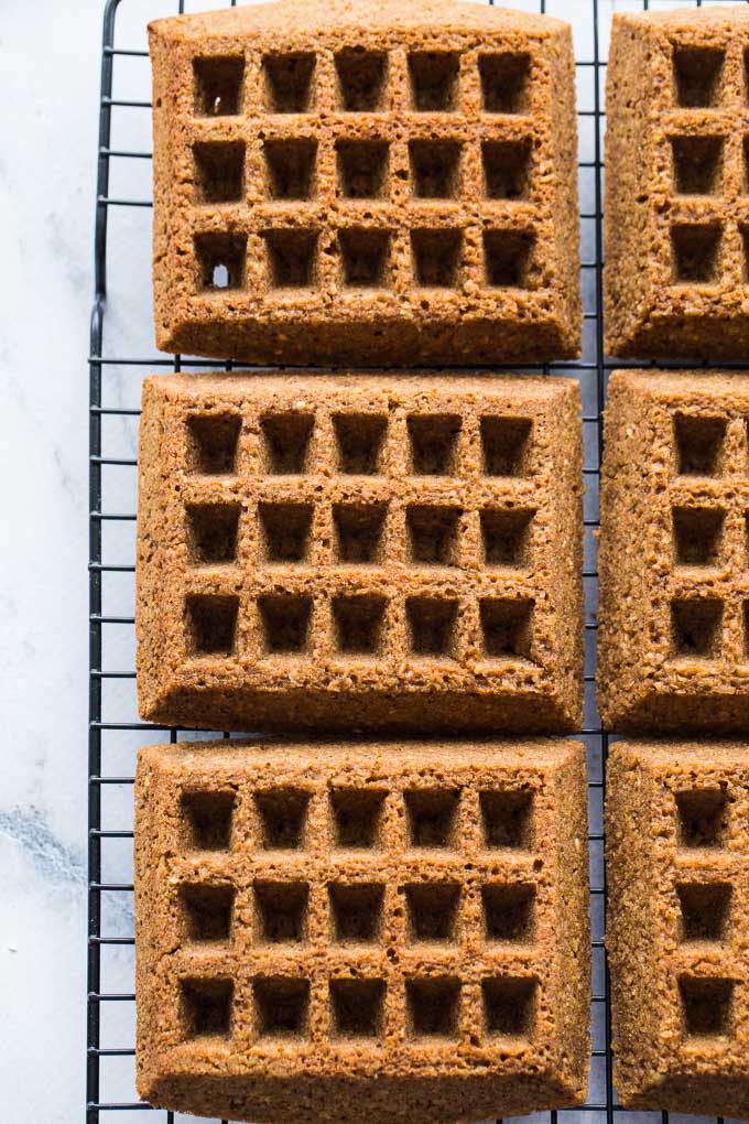 Overhead view of Gingerbread Waffles cooling on a wire rack.