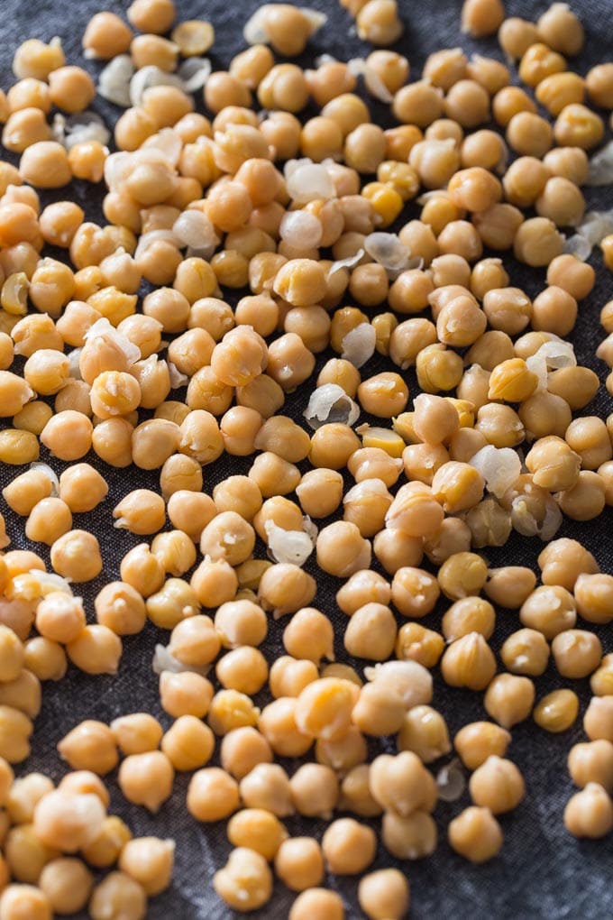 Up-close view of chickpeas drying on a towel.