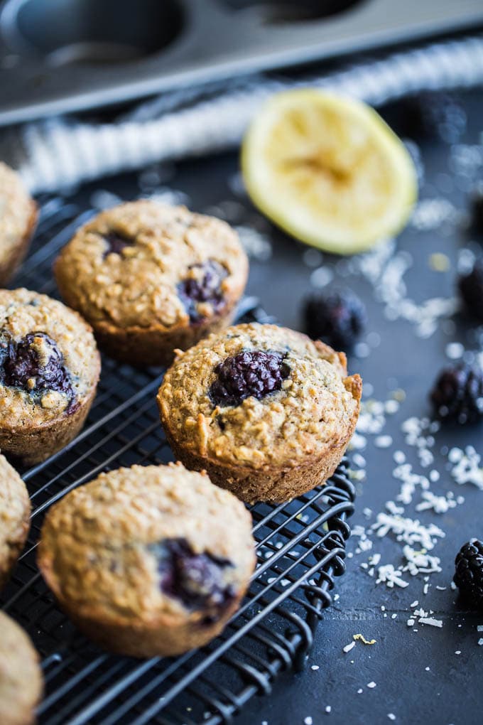 Up-close view of Blackberry Lemon Overnight Oatmeal Muffins cooling on a wire rack.
