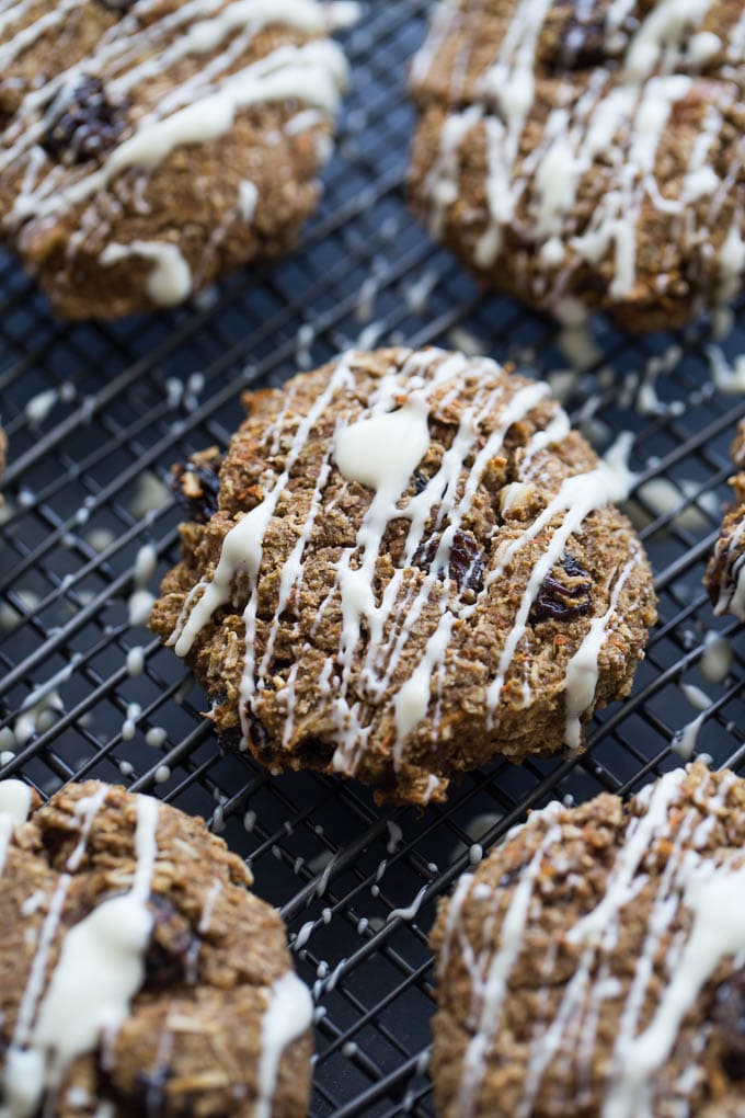 Up-close view of Morning Glory Breakfast Cookies with white chocolate drizzle.