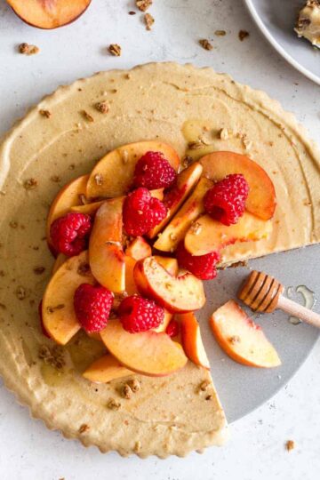 Overhead of dairy-free frozen peach pie with slices removed.