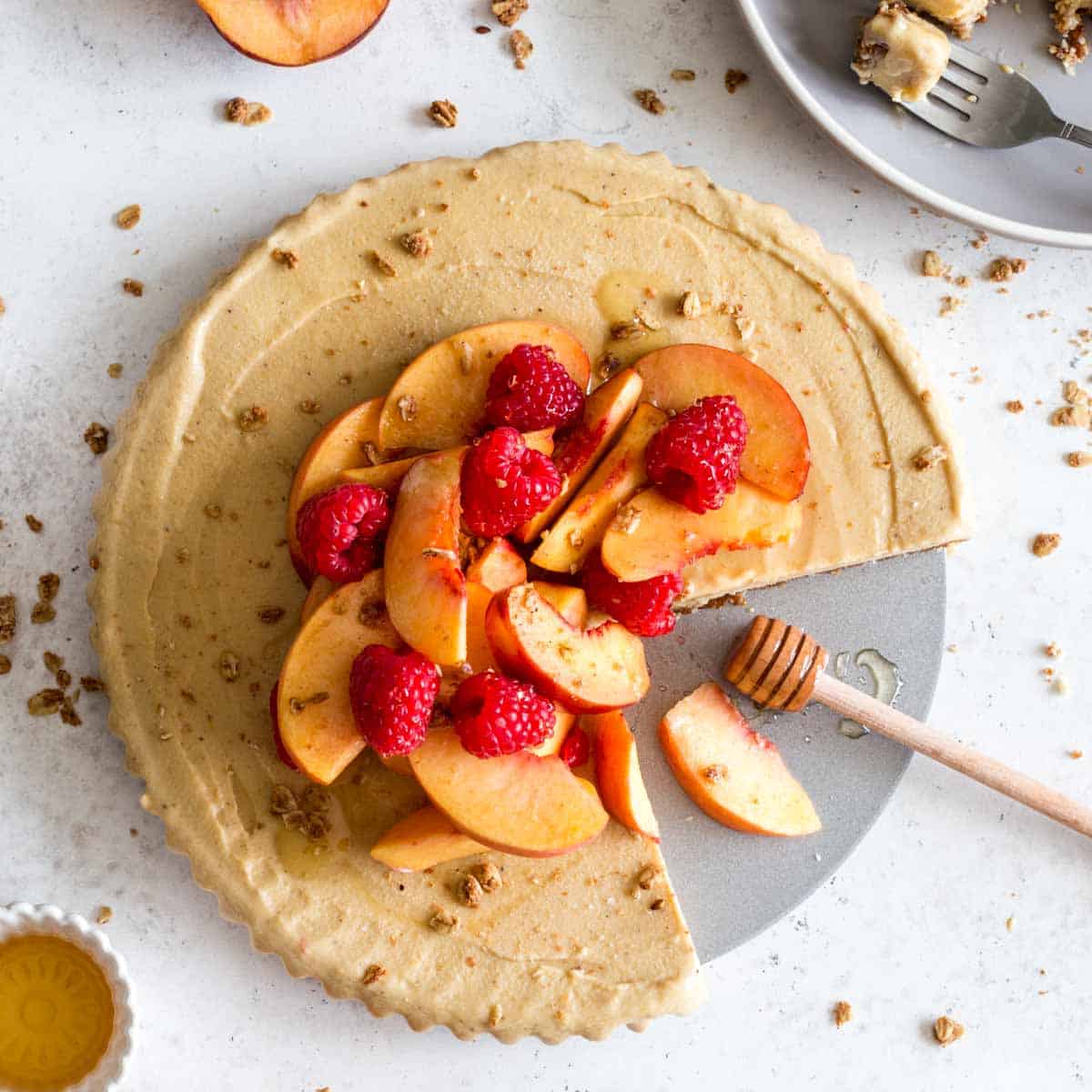 Overhead of dairy-free frozen peach pie with slices removed.