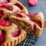 Side view of a slice of buttermilk plum cake being removed.