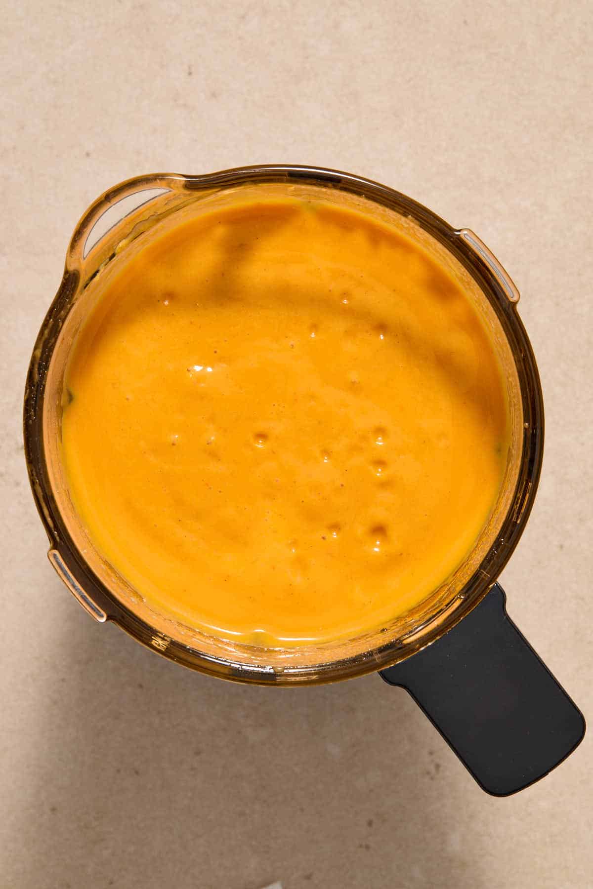 Overhead view of blended soup in blender.