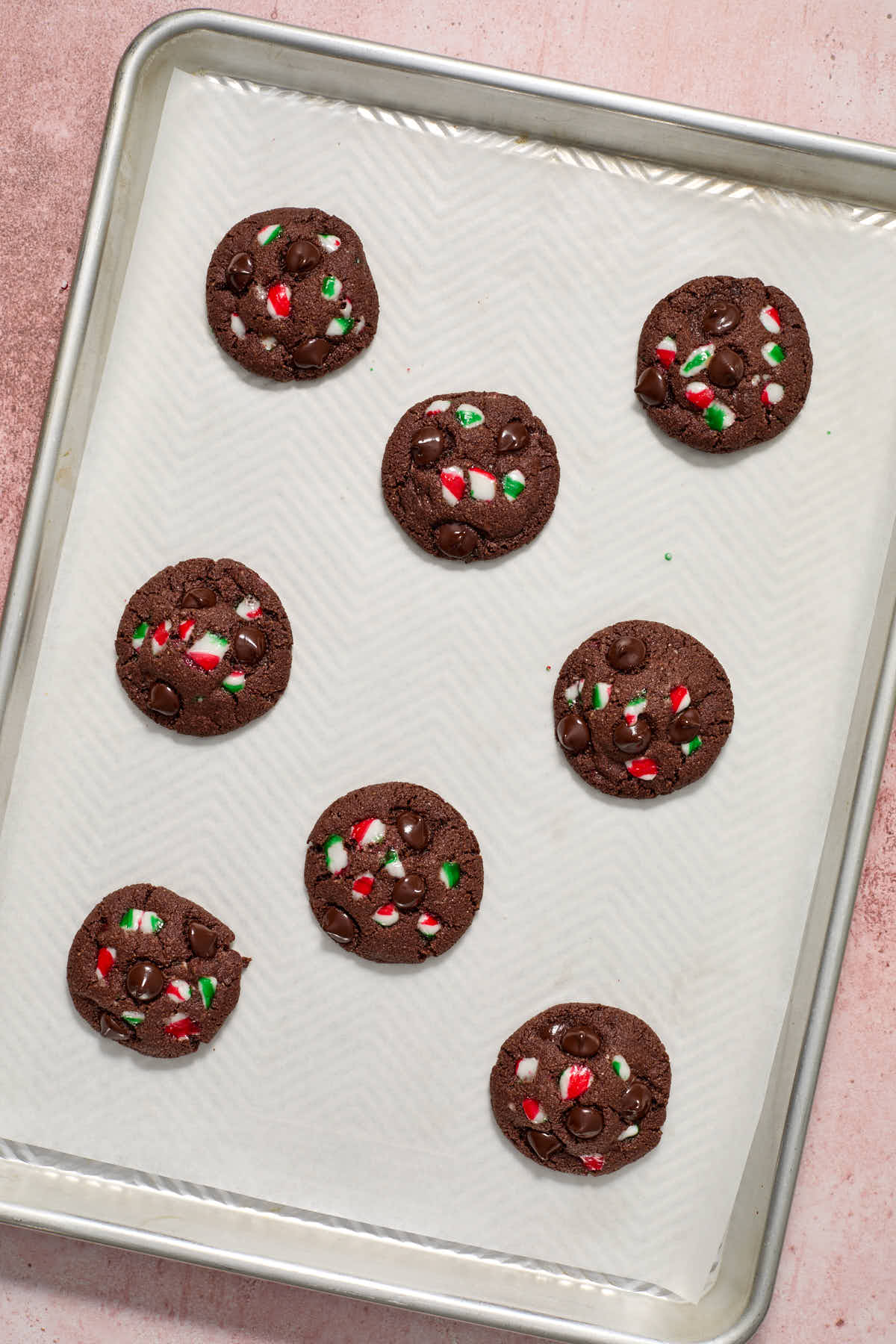 Baked cookies cooling on the baking sheet.