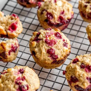 Partridgeberry Muffins cooling on a wire rack.