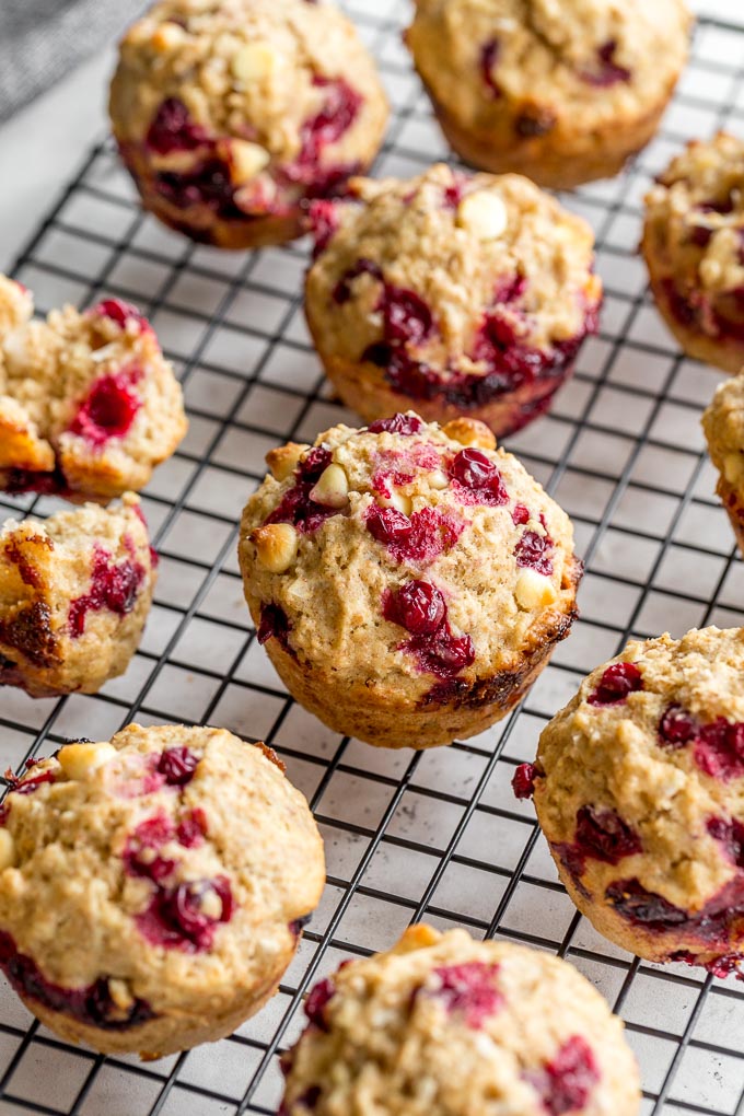 Up-close view of partridgeberry muffins cooling on a wire rack.