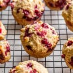 Partridgeberry muffins arranged on a wire rack.