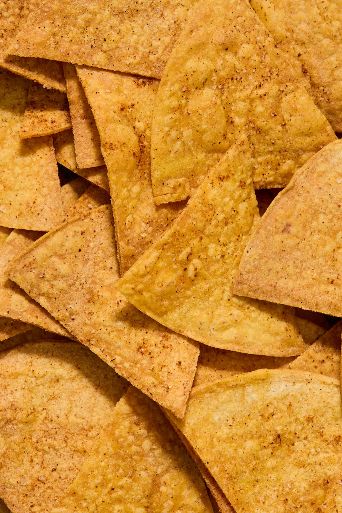 Close up view of air fried tortilla chips.