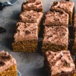 Angled view of sweet potato cake cut into squares and arranged next to each other.