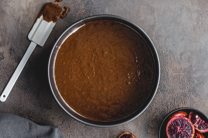 Chocolate cake batter poured into a springform pan.
