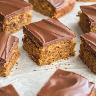 Banana snack cake topped with chocolate and cut into squares.