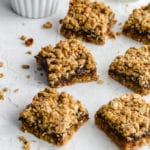 Healthy date squares arranged on a sheet of wax paper.