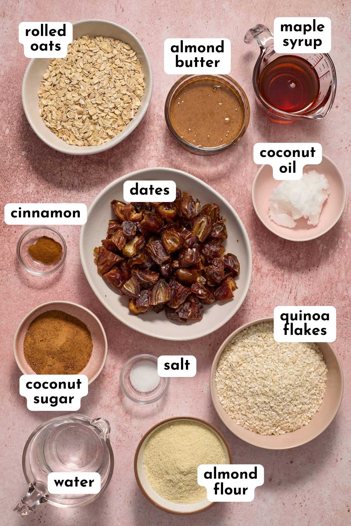 Ingredients to make date squares arranged in individual bowls and labeled.