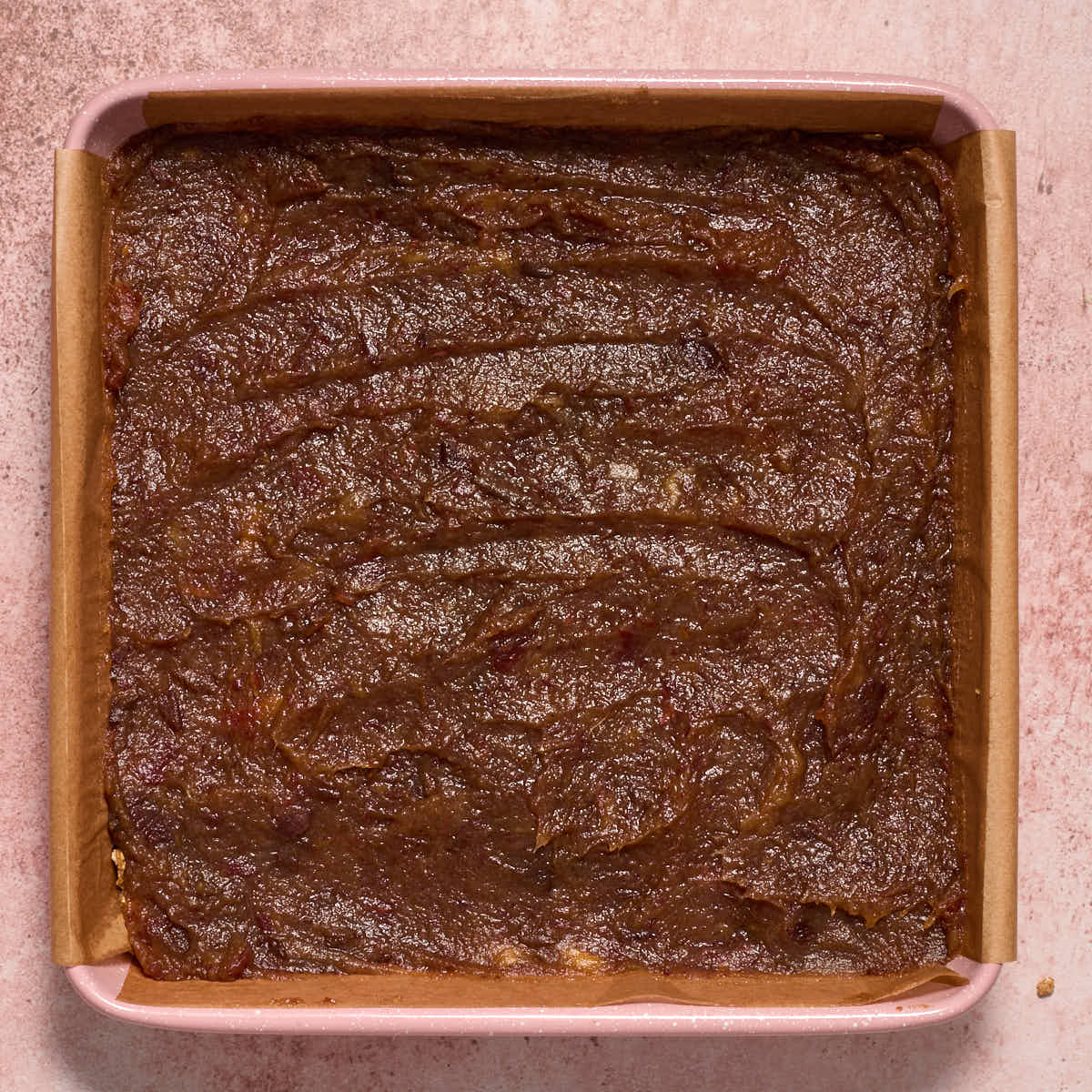 Date mixture spread over the base layer.