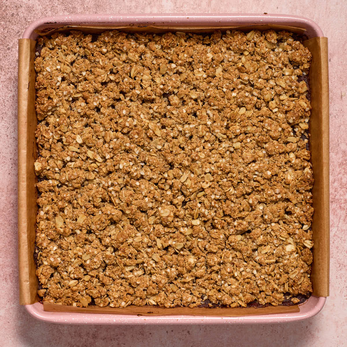 Baked date squares in a square pan.