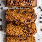 Overhead of spelt flour coconut banana bread cut into slices.