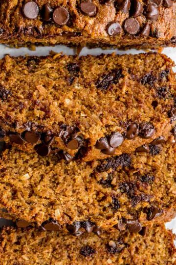 Overhead of spelt flour coconut banana bread cut into slices.