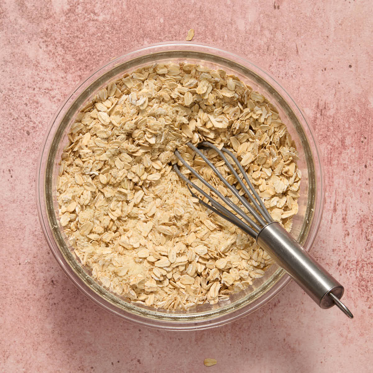 Oats, almond flour and salt whisked together in a small glass bowl.