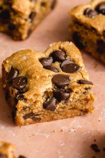 Angled view of almond flour blondies topped with chocolate chips.