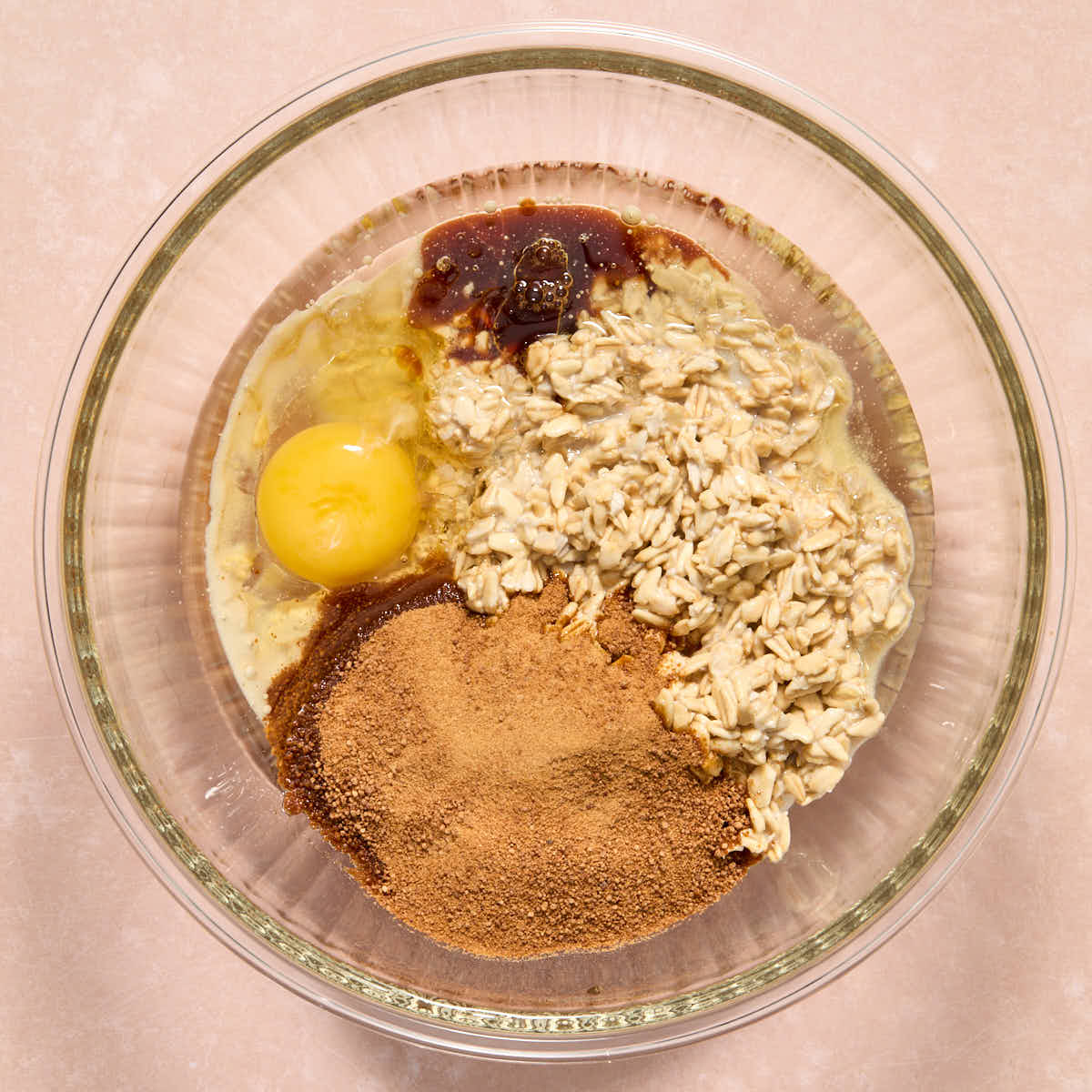 Soaked oats added to a bowl along with the sugar, egg, oil and vanilla.