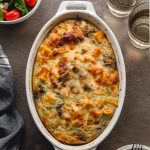 Sweet Potato Breakfast Casserole with ground turkey and eggs in a white, oval dish.