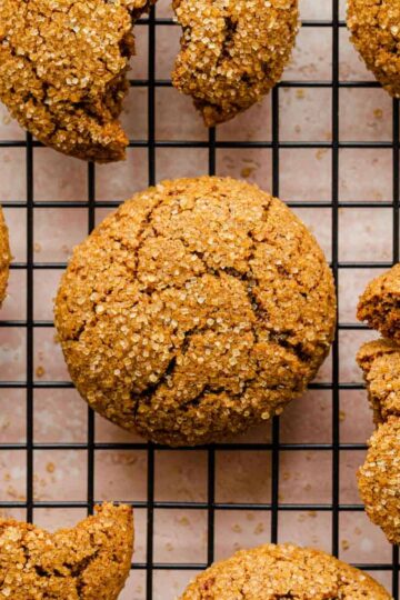 Overhead of ginger molasses cookies on a wire rack.