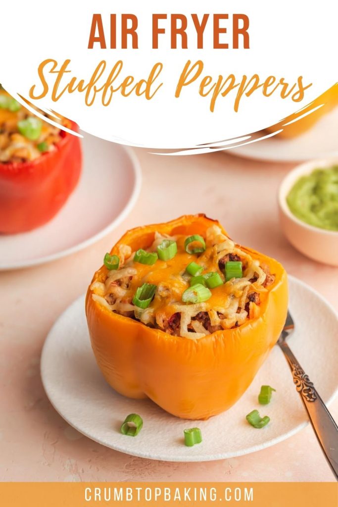 Pinterest image of air fryer stuffed peppers arranged on white plates.