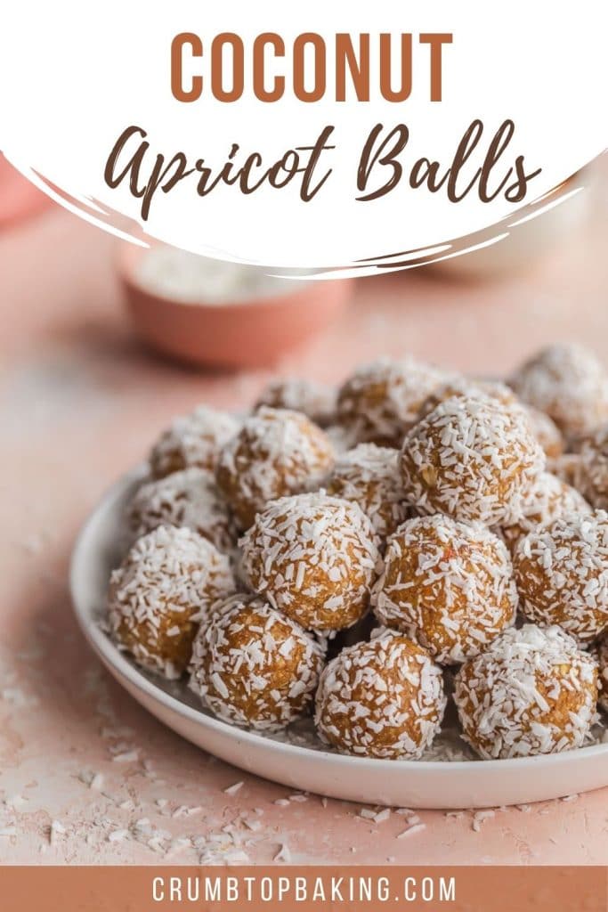 Pinterest image of coconut apricot balls piled on a plate.