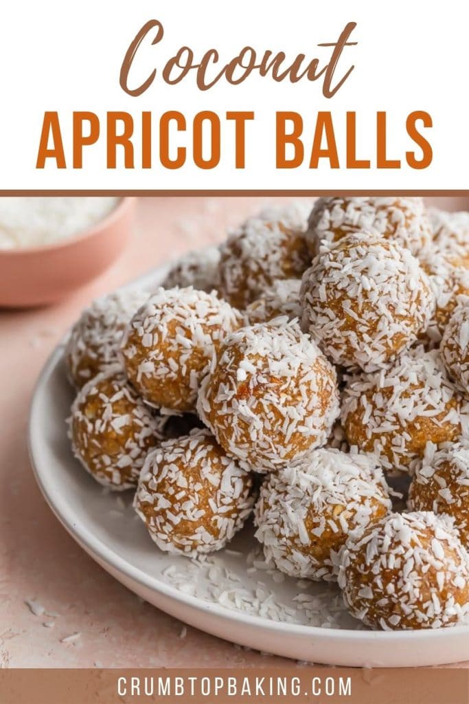 Pinterest image with a close up side view of coconut apricot balls on a white plate.