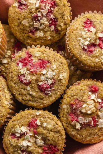 Overhead of lemon raspberry muffins in a basket.