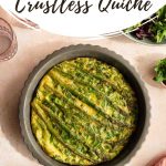 Pinterest image for an asparagus quiche in a grey pie dish on a pink surface.