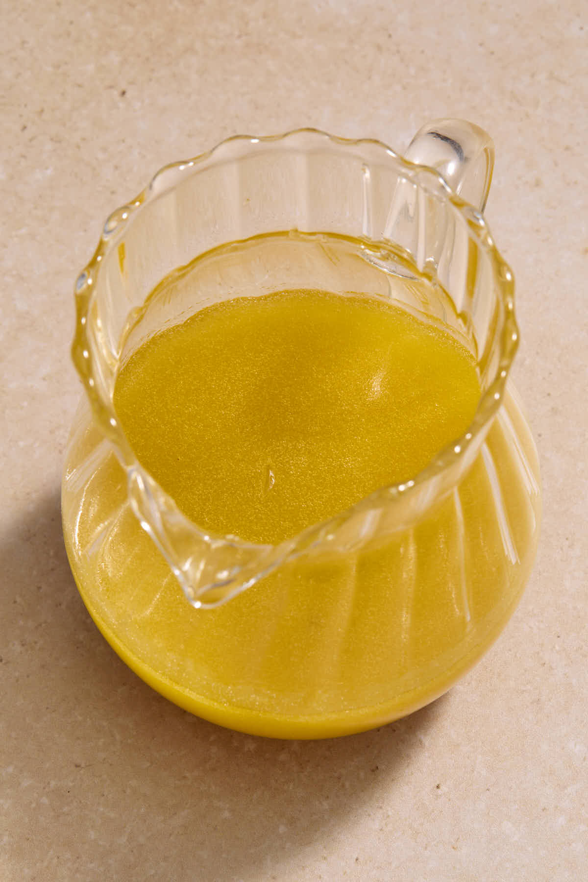 Vinaigrette mixed together in a small glass jug.