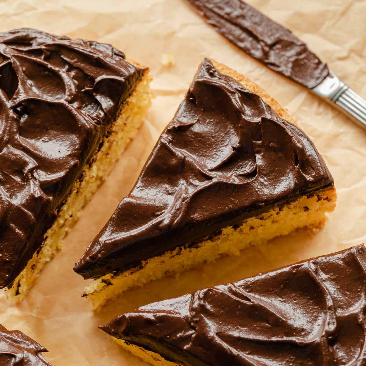 Slice of cake topped with chocolate avocado frosting.