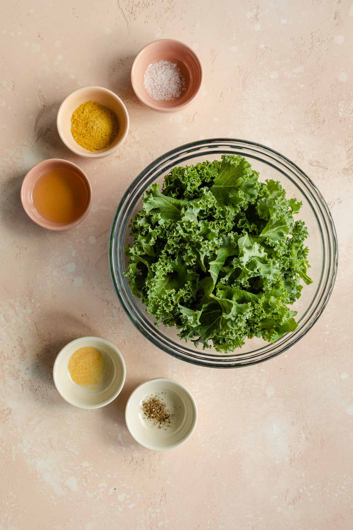 Ingredients to make kale chips arranged individually.