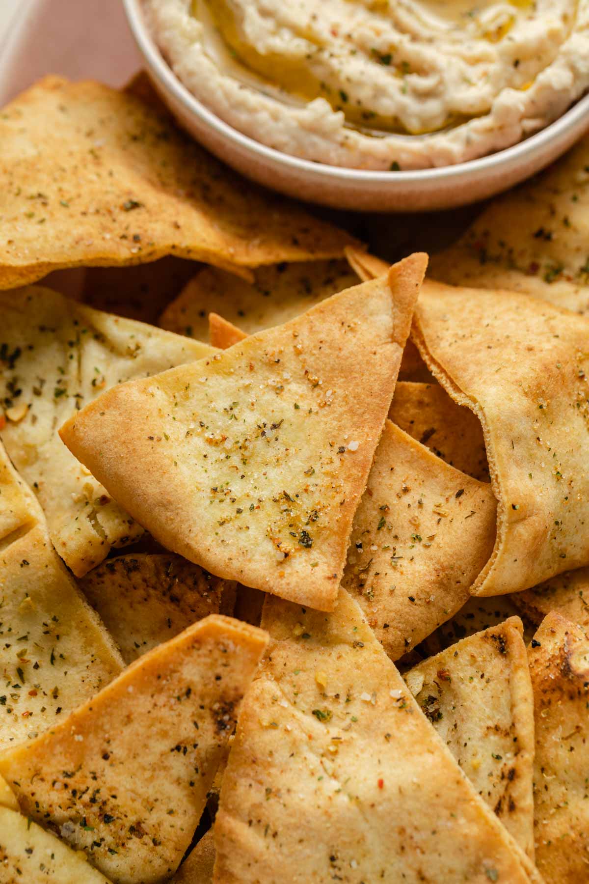 Close up view of air fried pita chips.