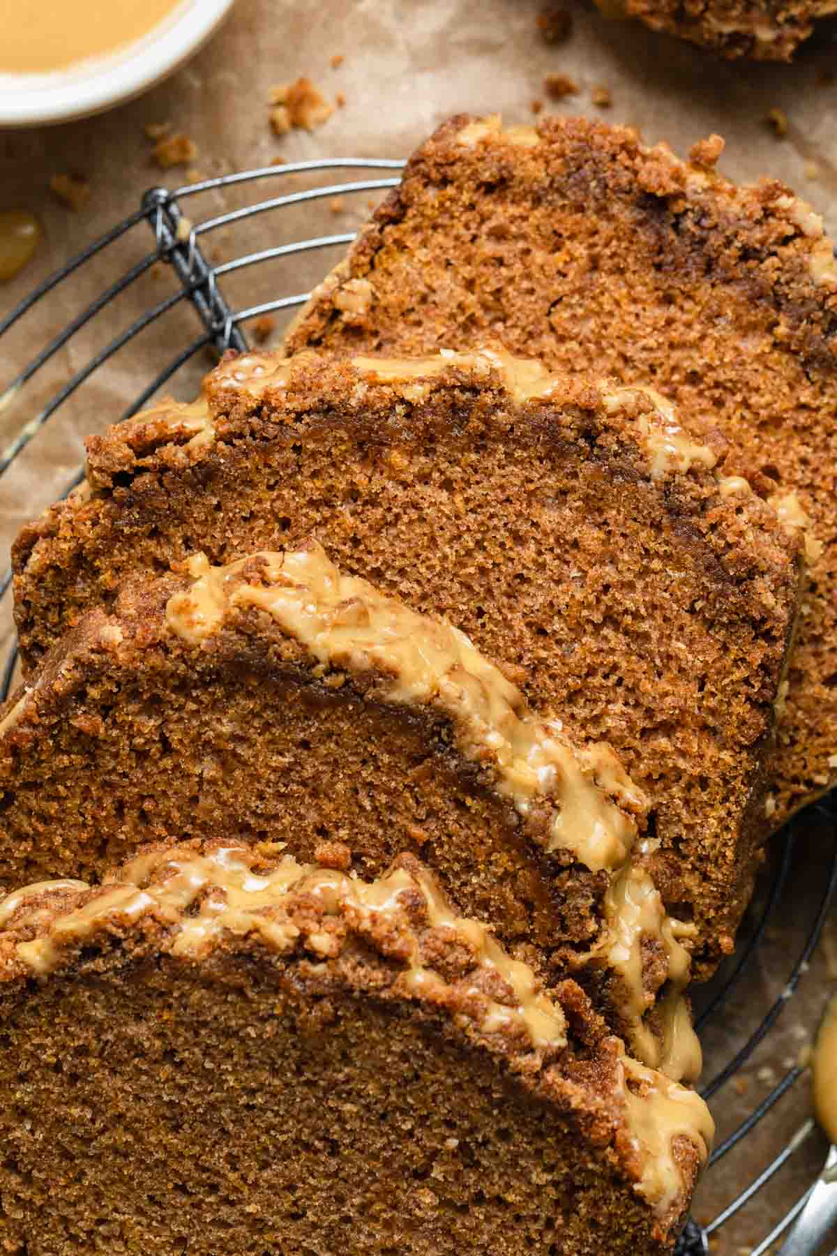 Close up view of slices of butternut squash bread with crumb topping.