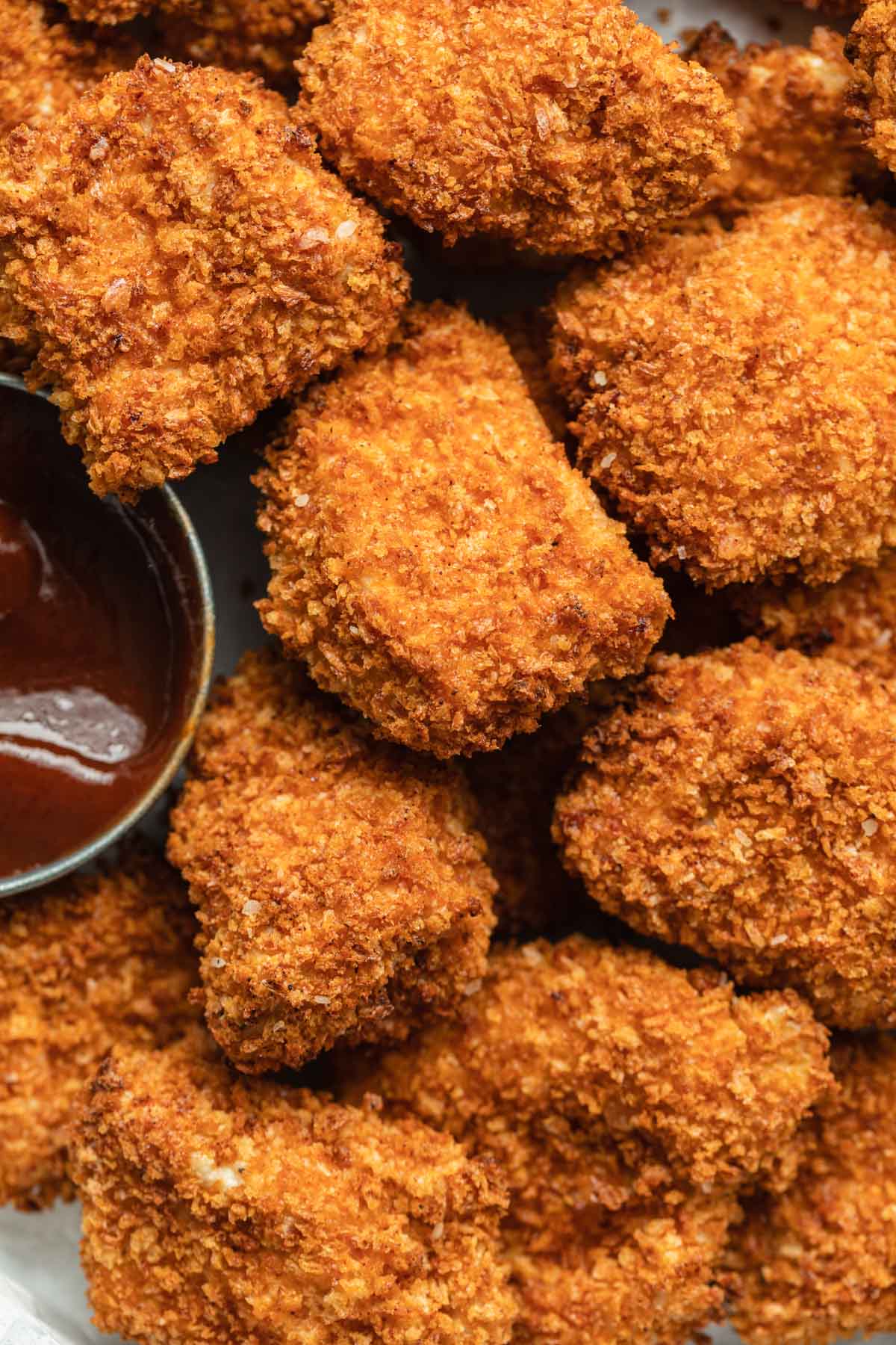 Close up view of air fried chicken nuggets.