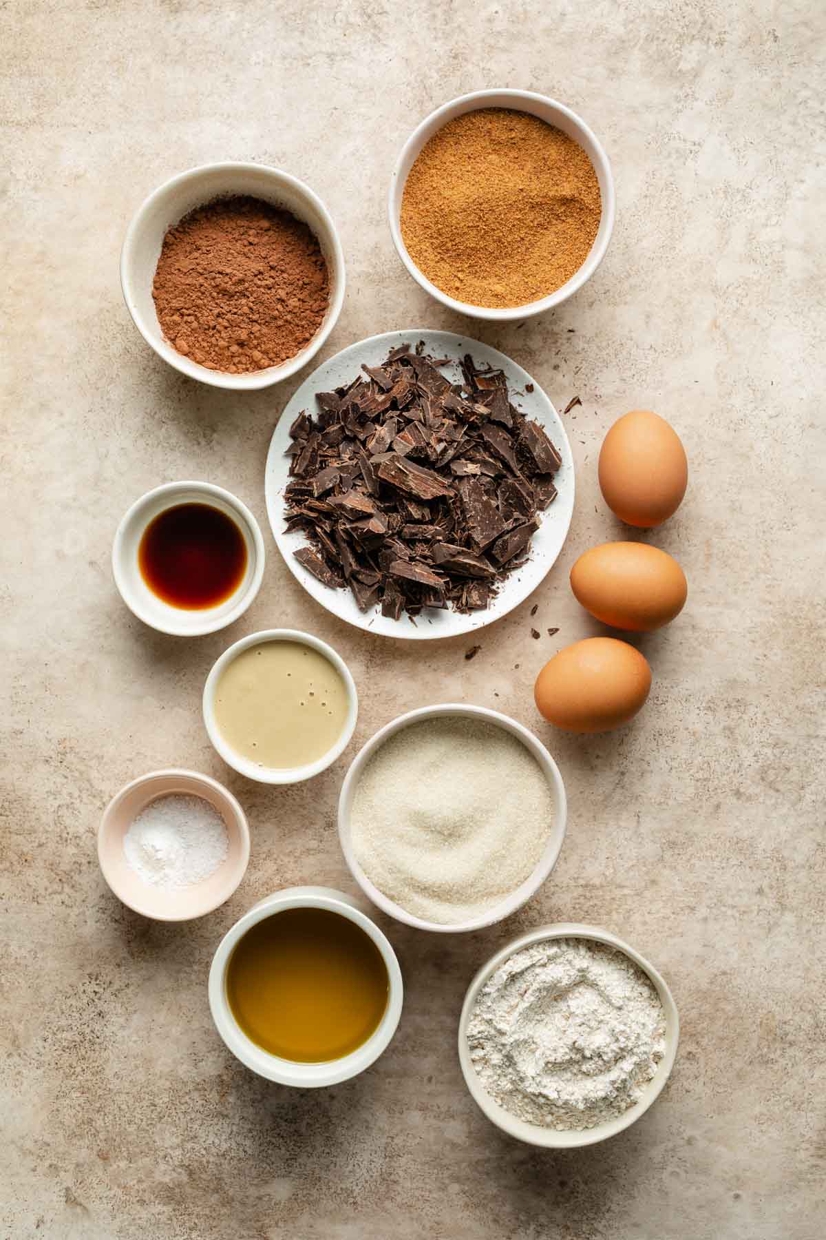 Ingredients to make tahini brownies arranged individually.