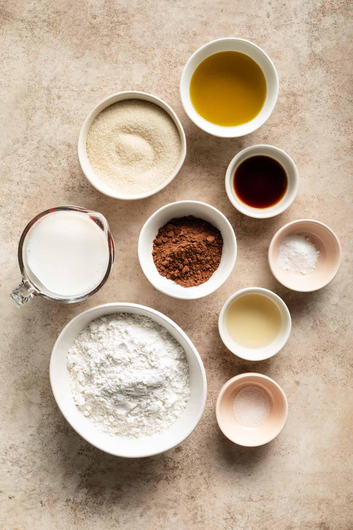 Ingredients to make air fryer cake arranged in individual bowls.