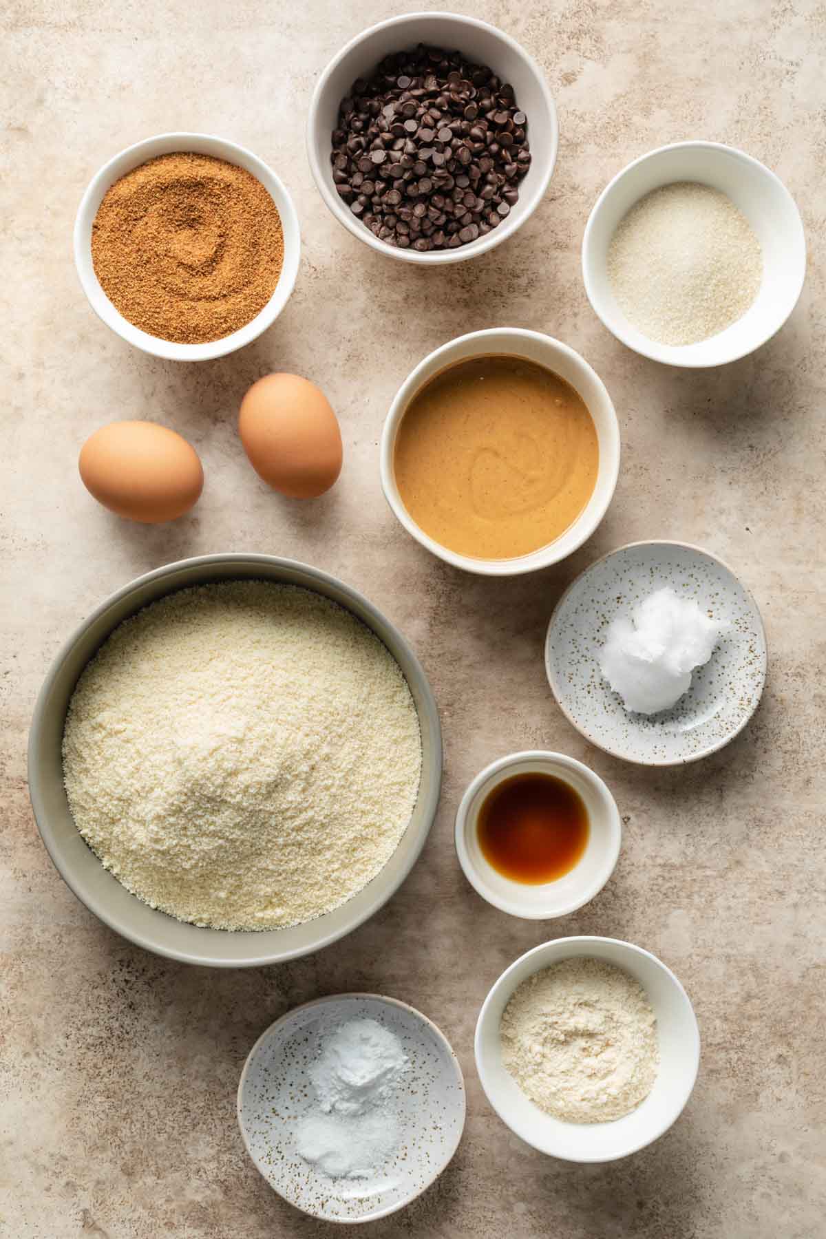 Ingredients to make almond flour peanut butter cookies arranged individually.