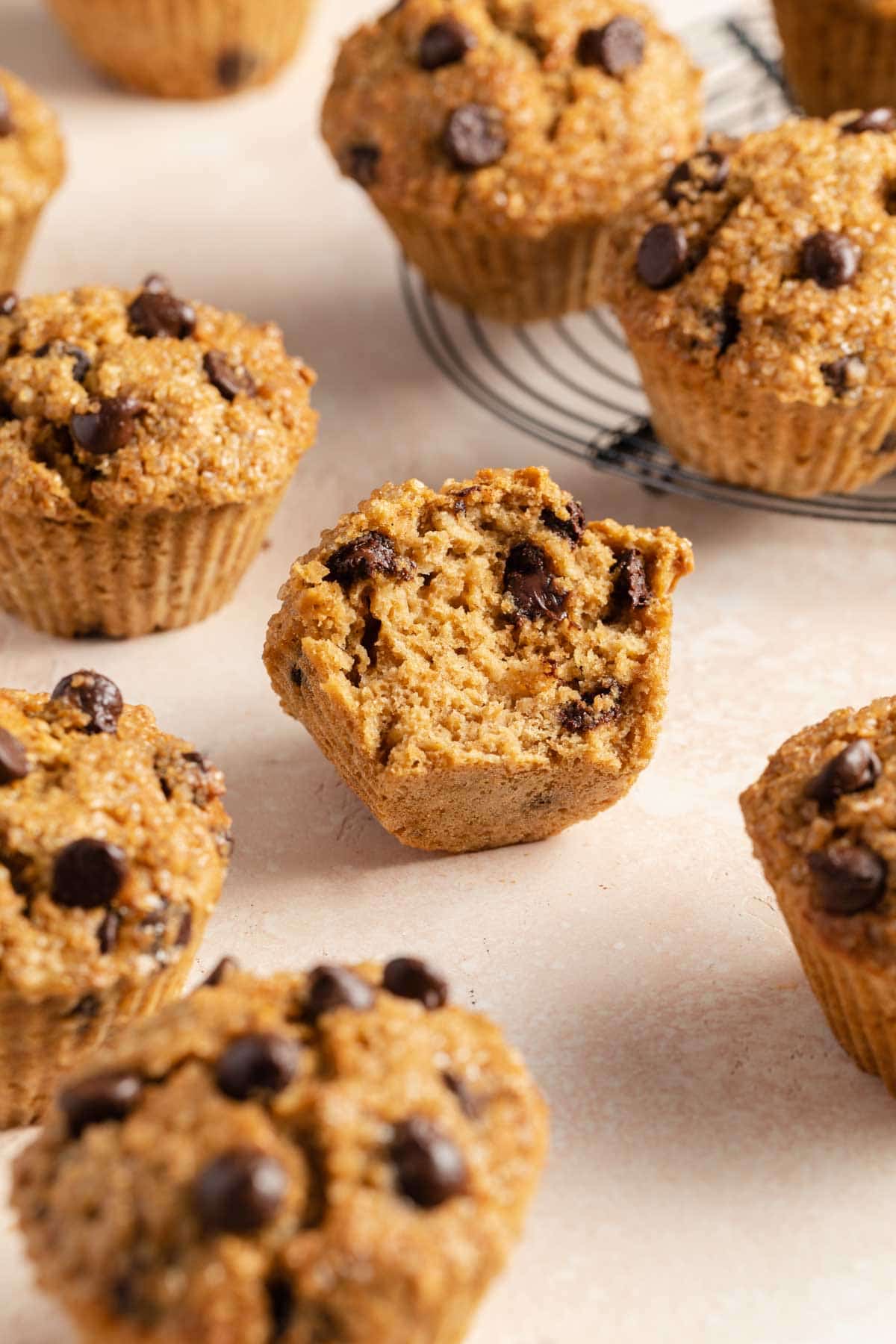 Chocolate chip oatmeal muffins with a bite taken out of one.